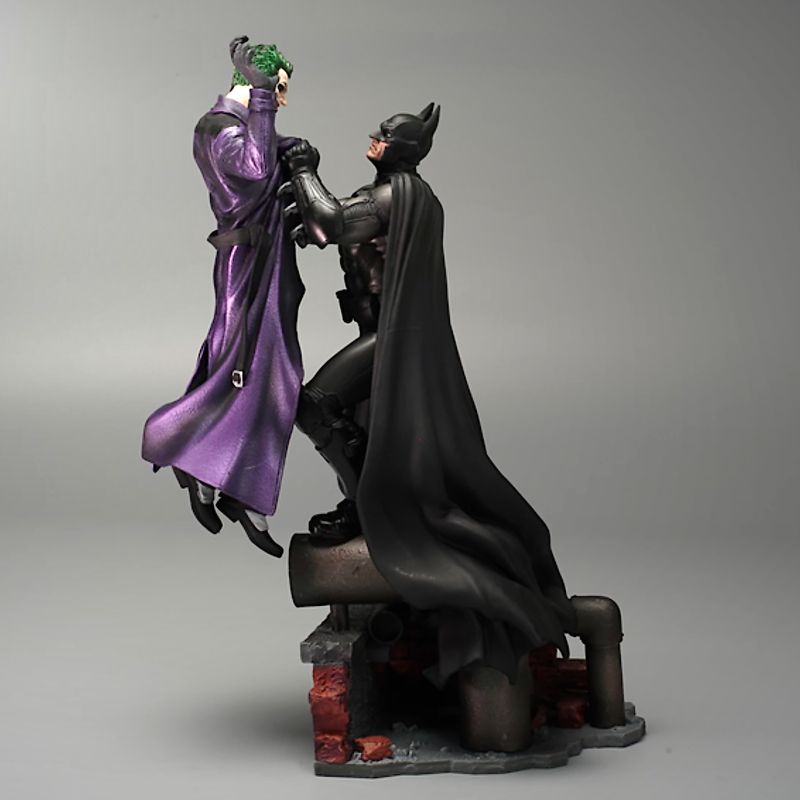 Batman holding the Joker Batman: Arkham Origins Collector’s Edition